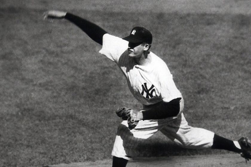 **FILE** In this 1956 file photo, New York Yankees right-hander Don Larsen delivers a pitch in the fourth inning of Game 5 of the World Series Oct. 8, 1956 en route to the first World Series perfect game. The Yankees won 2-0 and went on to win the series. (AP Photo)