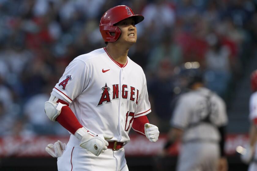 Los Angeles Angels designated hitter Shohei Ohtani reacts after flying out during the first inning of the team's baseball game against the New York Yankees in Anaheim, Calif., Tuesday, Aug. 31, 2021. (AP Photo/Alex Gallardo)