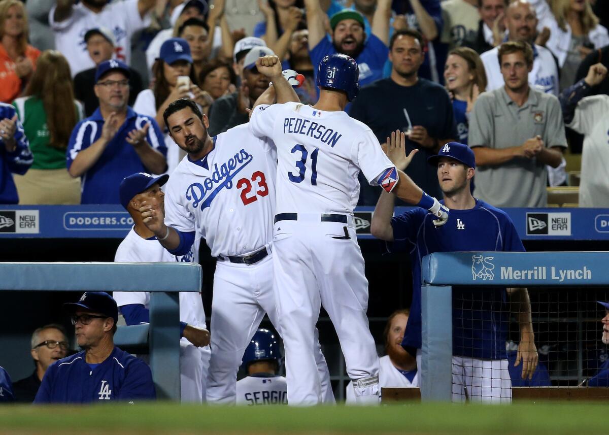 LOS ANGELES, CA - SEPTEMBER Joc Pederson #31 of the Los Angeles Dodgers is greeted by Adrian Gonzalez #23 as he returns to the dugout after hitting a solo home run in the seventh inning against the the San Francisco Giants at Dodger Stadium on September 1, 2015 in Los Angeles, California (Photo by Stephen Dunn/Getty Images) ** OUTS - ELSENT, FPG - OUTS * NM, PH, VA if sourced by CT, LA or MoD **