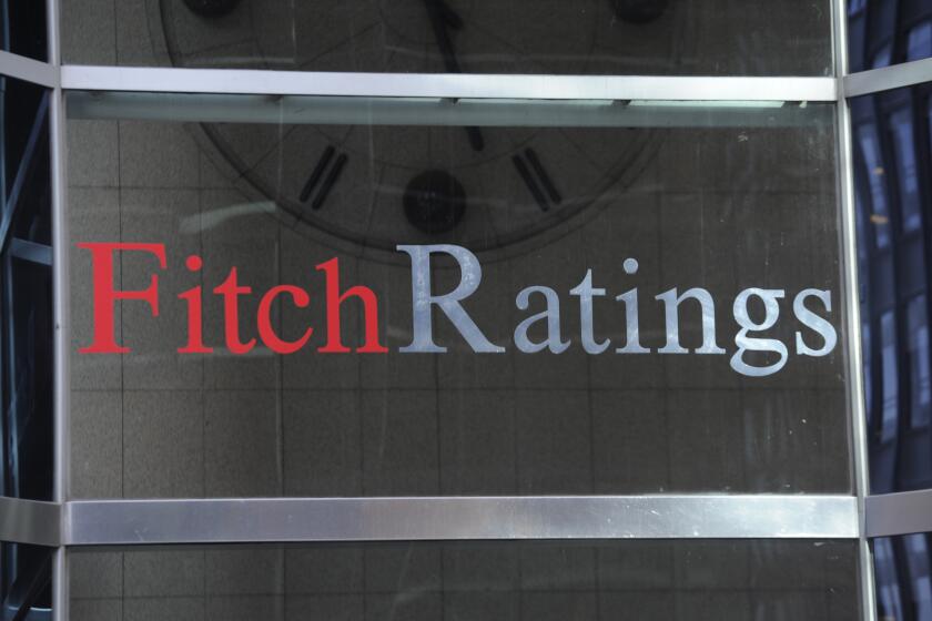 FILE - This photo shows signage for Fitch Ratings, Sunday, Oct. 9, 2011, in New York. On Tuesday, Aug. 1, 2023, Fitch Ratings has downgraded the U.S. credit rating, citing an expected increase in government debt over the next three years and a “steady deterioration in standards of governance” over the past two decades. (AP Photo/Henny Ray Abrams, File)