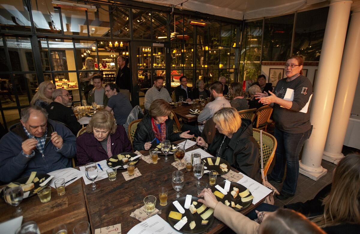Cheesemonger Tracy Nelsen teaches a cheese education class at Five Crowns.