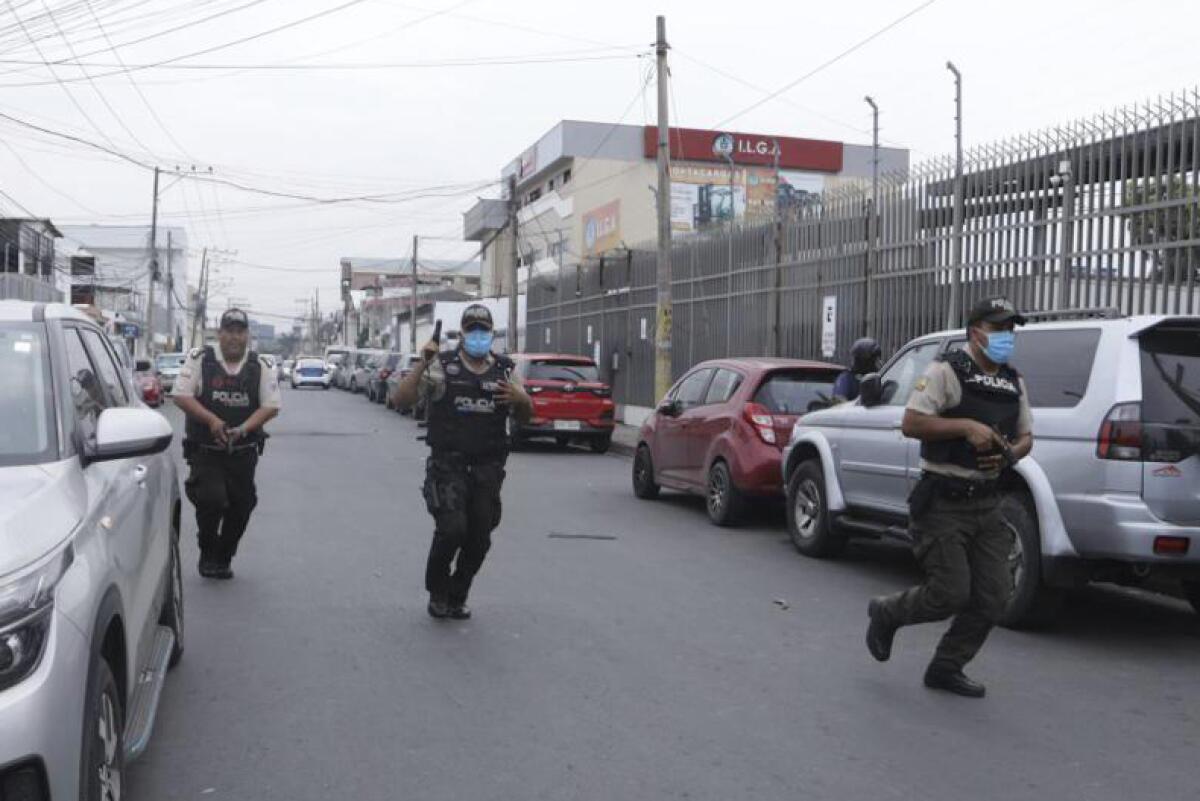 Police respond to an attack at the TC Television network in Guayaquil, Ecuador.
