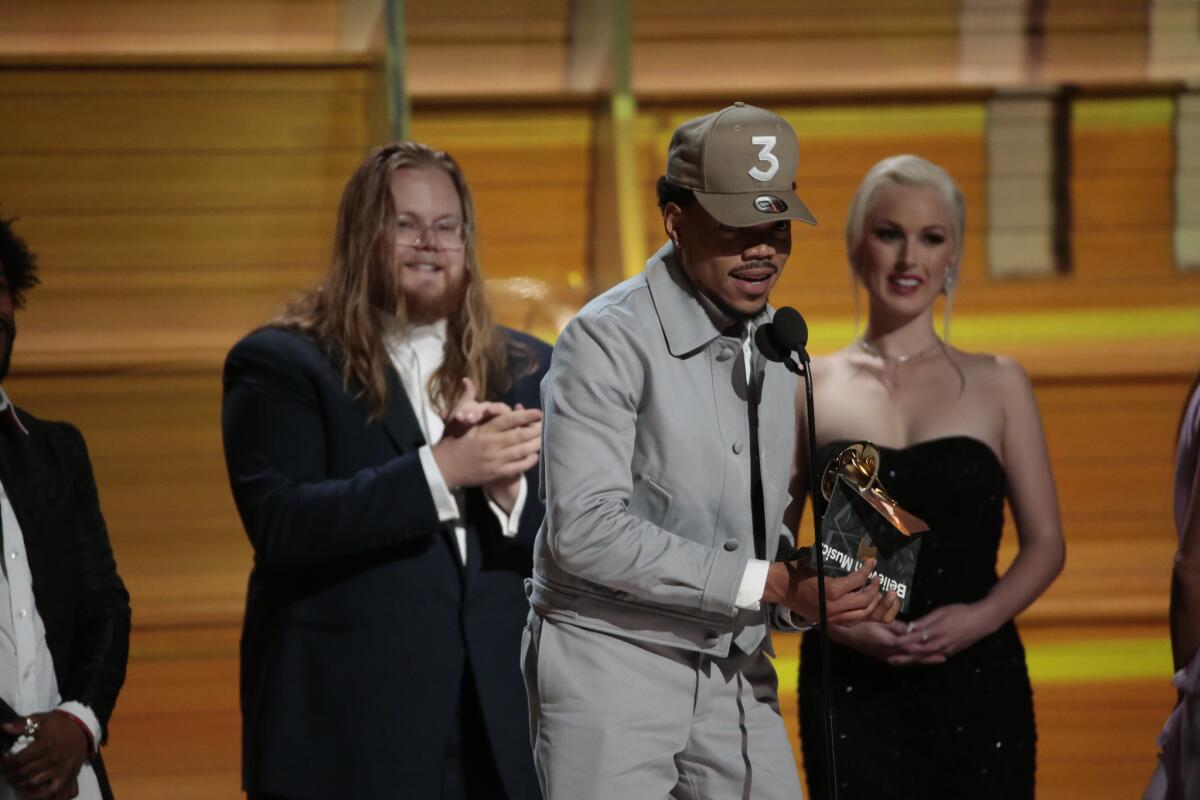 Chance the Rapper accepts one of his Grammys at Staples Center on Feb. 12.