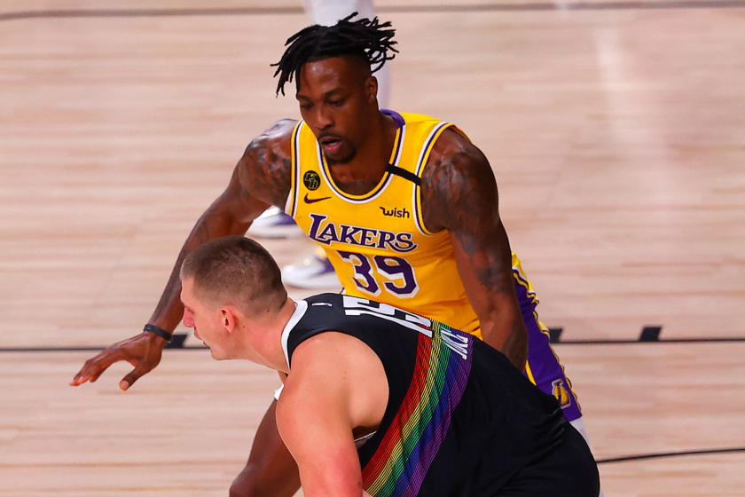 LAKE BUENA VISTA, FLORIDA - SEPTEMBER 24: Nikola Jokic #15 of the Denver Nuggets drives the ball against Dwight Howard #39 of the Los Angeles Lakers during the third quarter against the Los Angeles Lakers in Game Four of the Western Conference Finals during the 2020 NBA Playoffs at AdventHealth Arena at the ESPN Wide World Of Sports Complex on September 24, 2020 in Lake Buena Vista, Florida. NOTE TO USER: User expressly acknowledges and agrees that, by downloading and or using this photograph, User is consenting to the terms and conditions of the Getty Images License Agreement. (Photo by Mike Ehrmann/Getty Images)