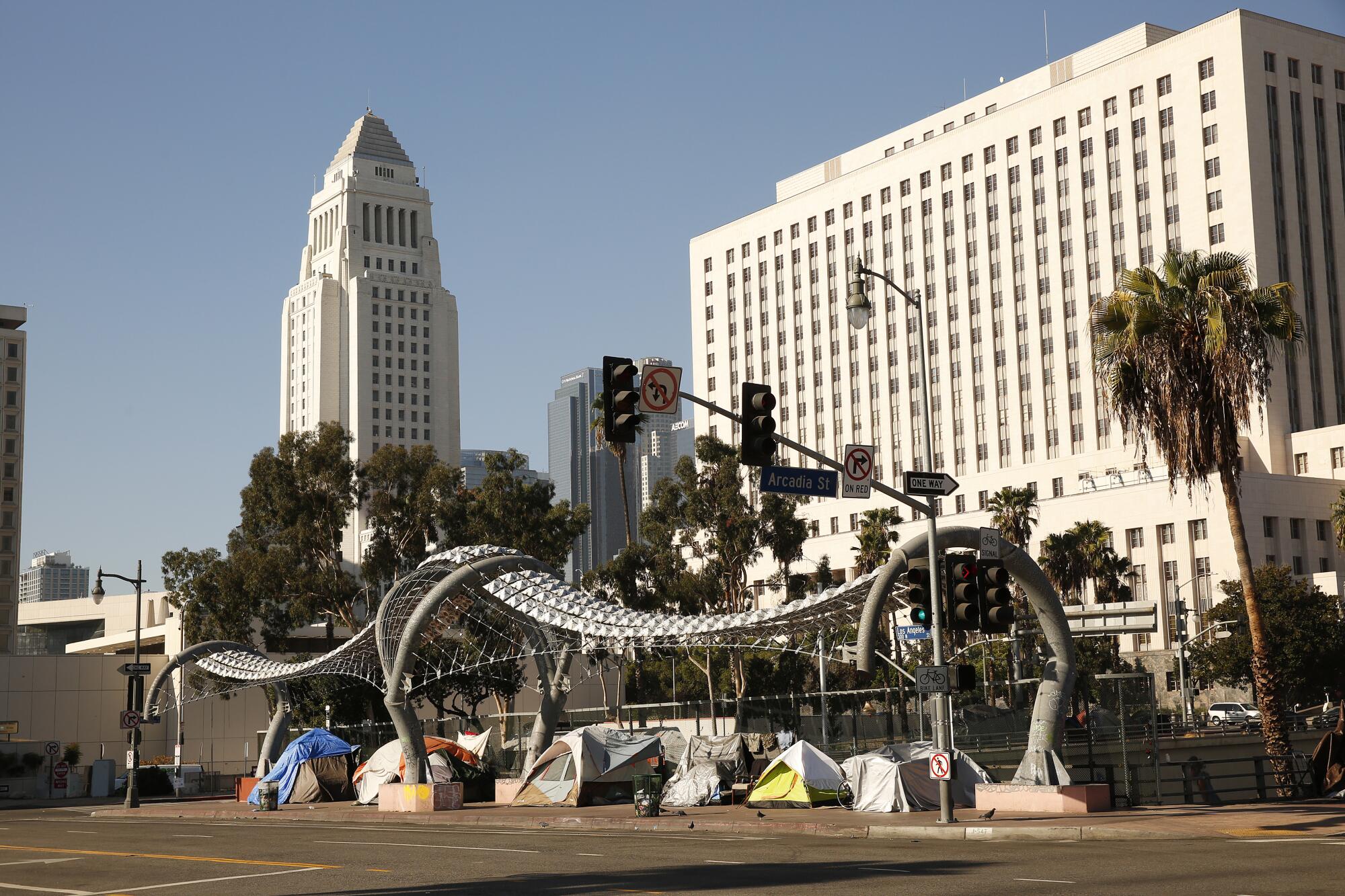 Tents along Los Angeles Street over the 101 Freeway. 