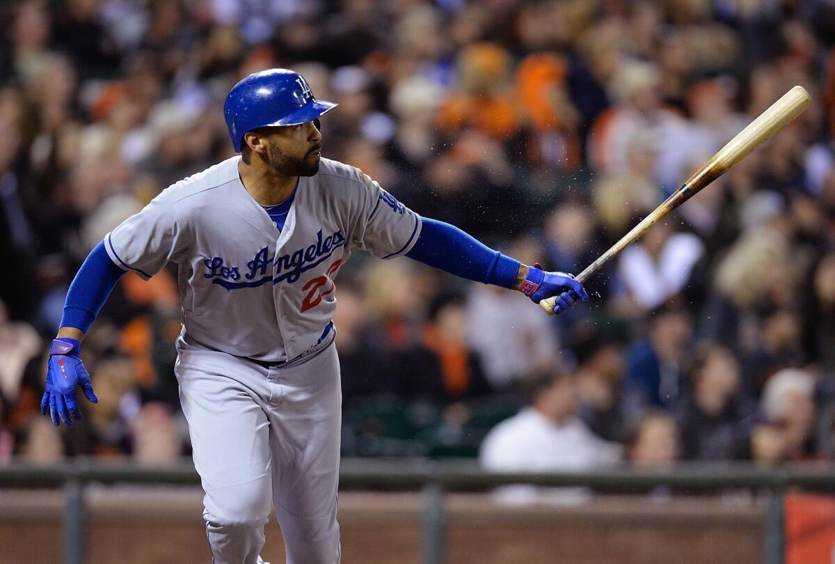 Matt Kemp hits a solo home run during the sixth inning against the San Francisco Giants at AT&T; Park on Tuesday night.