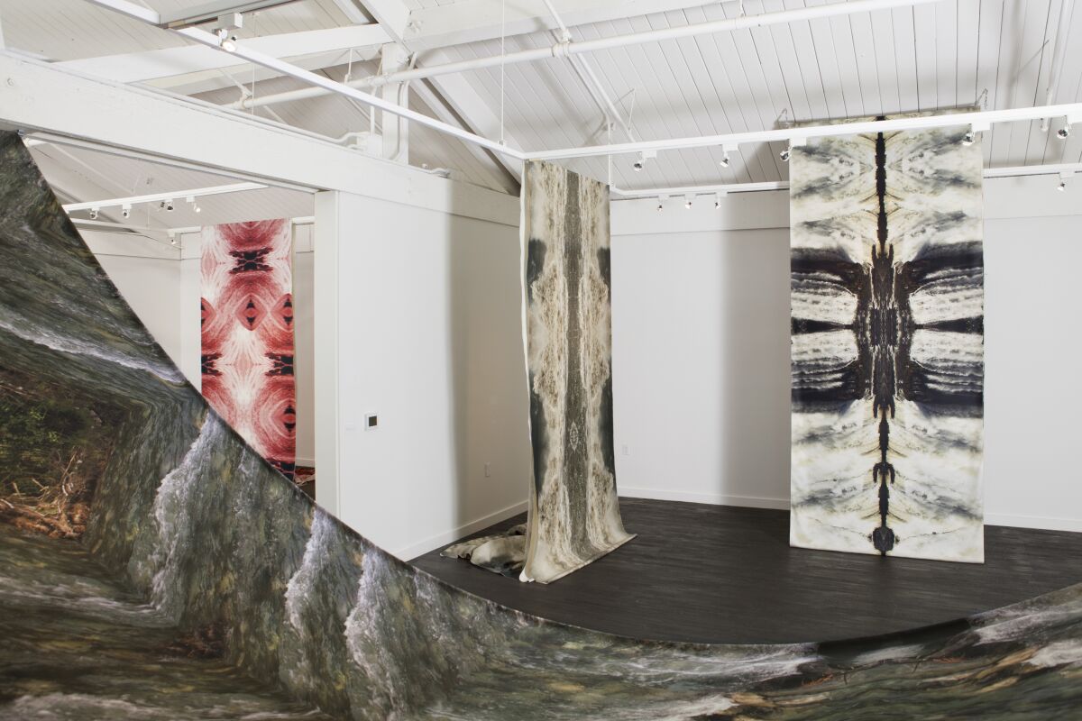 An installation view of Carolina Caycedo's water portraits at the Orange County Museum of Art's temporary space in Santa Ana.