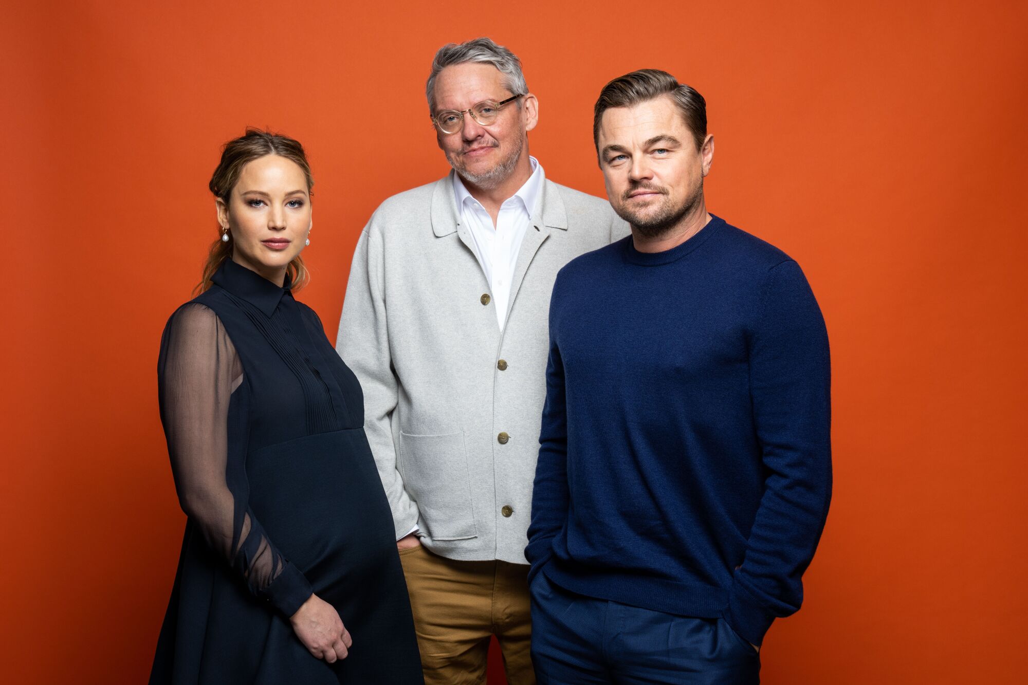Actor Jennifer Lawrence, director Adam McKay, and actor Leonardo DiCaprio 