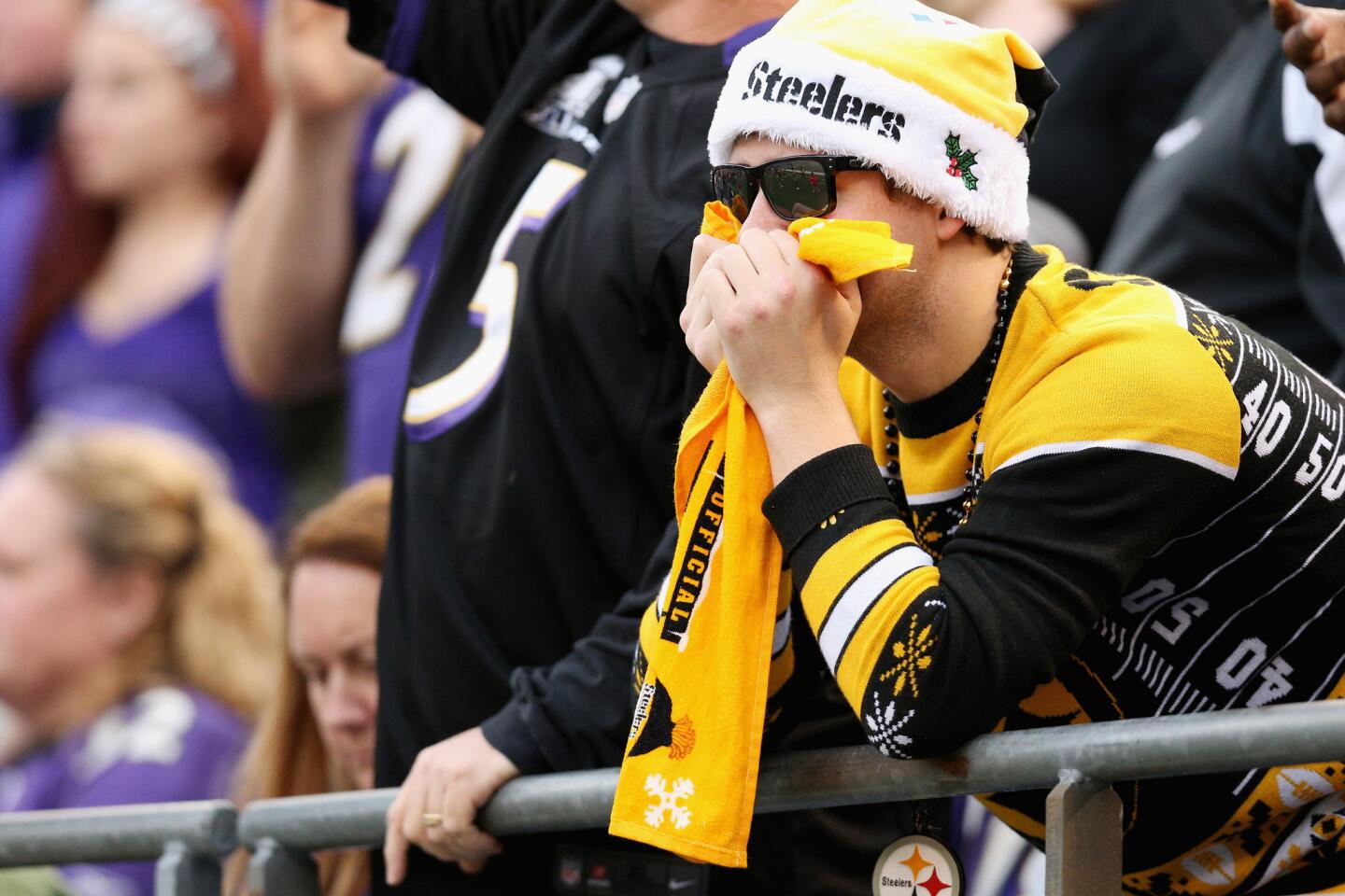 A Pittsburgh Steelers fan reacts during the fourth quarter against the Baltimore Ravens at M&T Bank Stadium on December 27, 2015. The Ravens, with only four wins prior, created havoc for the Steelers' playoff chances with a stunning 20-17 win.