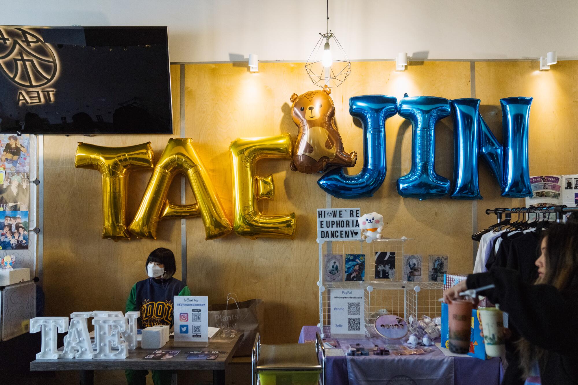 Displays of merch at a cupsleeve event at R&B Tea.