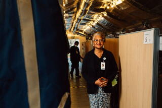 Dr. Elaine Batchlor stands inside one of the hospital's makeshift triage centers, which serve as initial assessment areas Photographer: Anna Sophia Moltke/Bloomberg