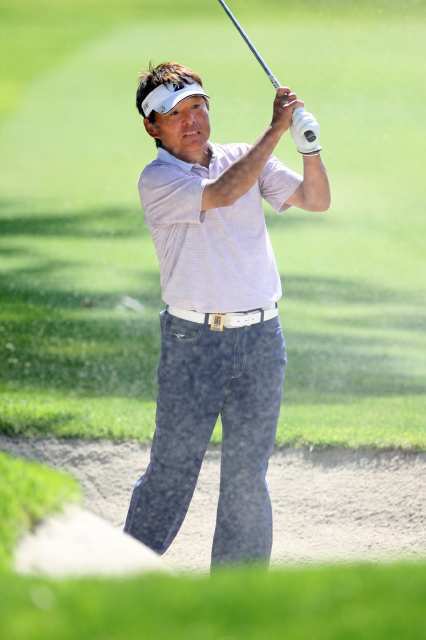 Joe Ozaki of Japan hits out of a bunker of the 11th hole during the second round of the Toshiba Classic golf tournament at Newport Beach Country Club on Saturday. Ozaki sits in third place at 10 under going into Sunday's final round.