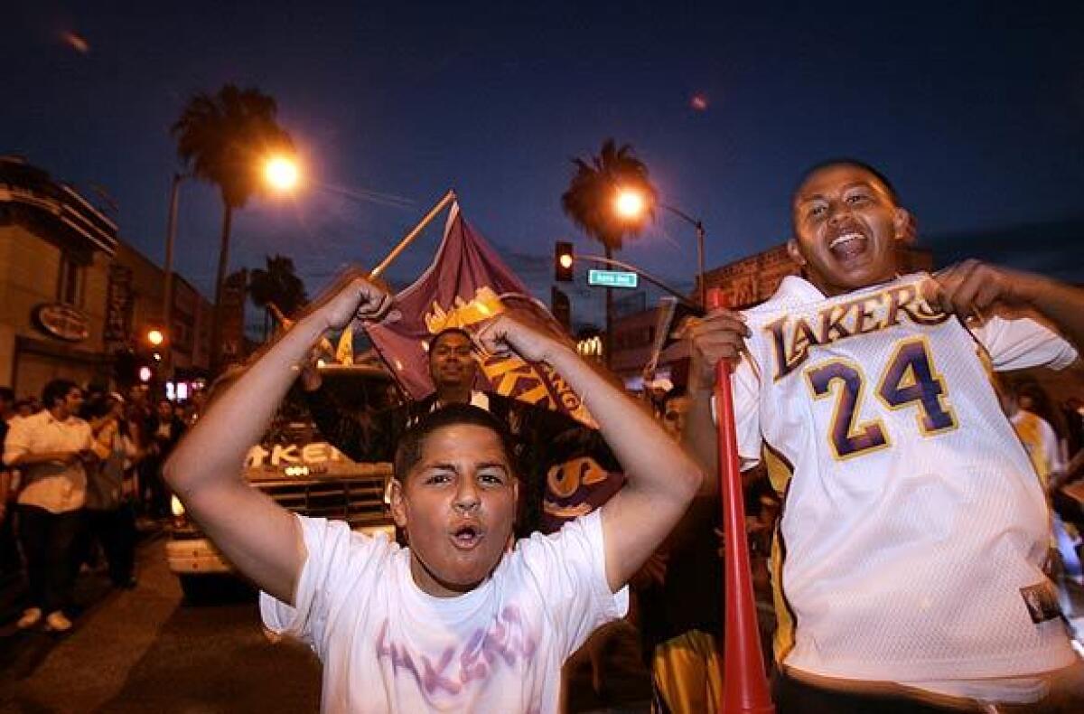 Lakers fans cruise up and down Whittier Boulevard in East Los Angeles 