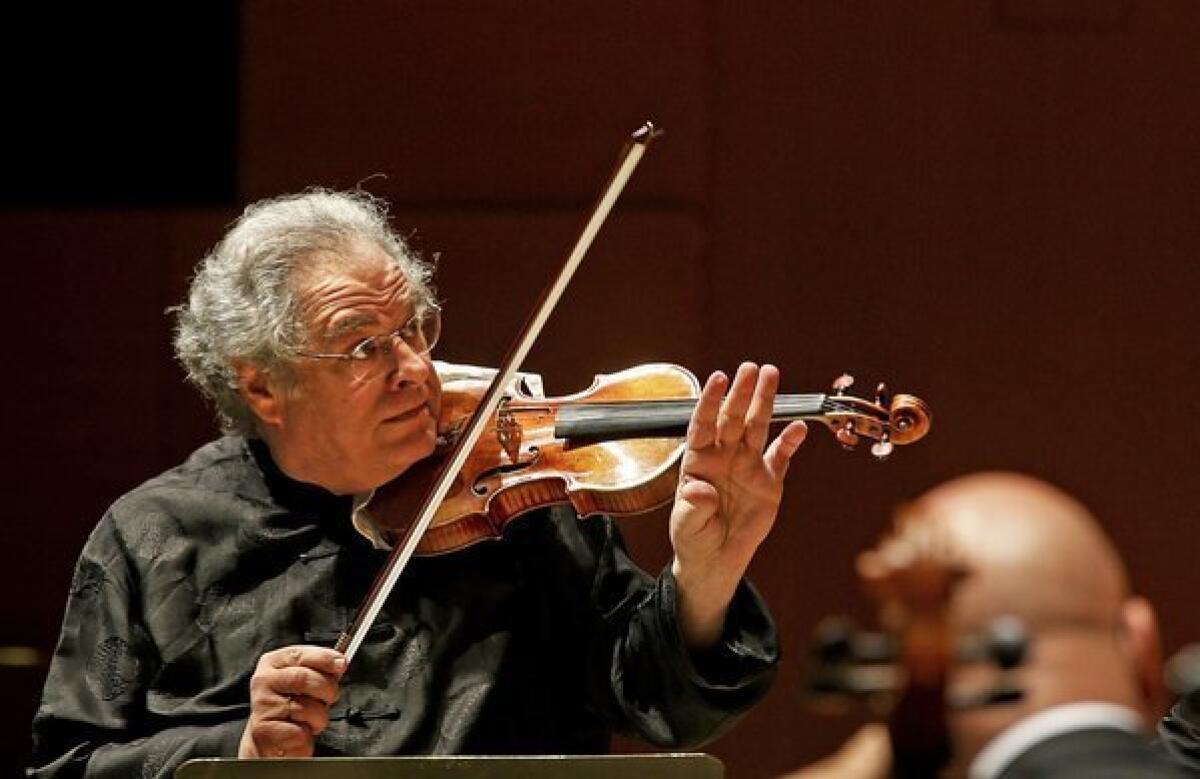 Itzkhak Perlman does double duty as he plays the violin and conducts the L.A. Phil in three programs.