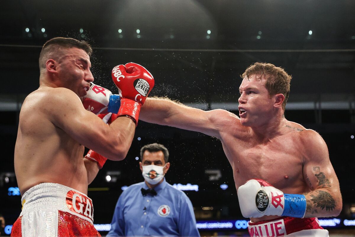 Canelo Alvarez punches Avni Yildirim during their title fight on Saturday.