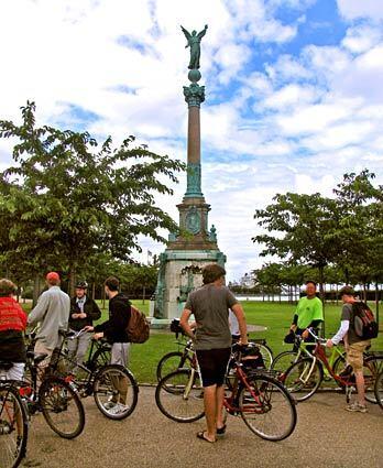 A bike tour passes through Copenhagen Harbor