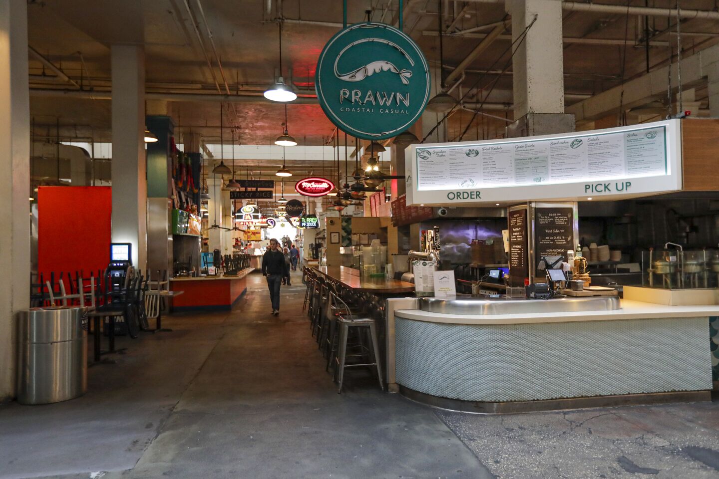 Normally bustling Grand Central Market in downtown L.A. is open only for take out.