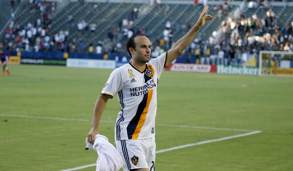 Landon Donovan thanks cheering L.A. Galaxy fans during his first game back from retirement as the Galaxy beat the Orlando City SC, 4-2, at the Stub Hub Center on Sept. 11.