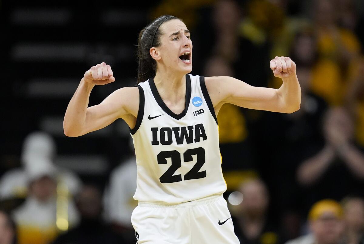 Iowa guard Caitlin Clark pumps both fists during an NCAA tournament game against West Virginia