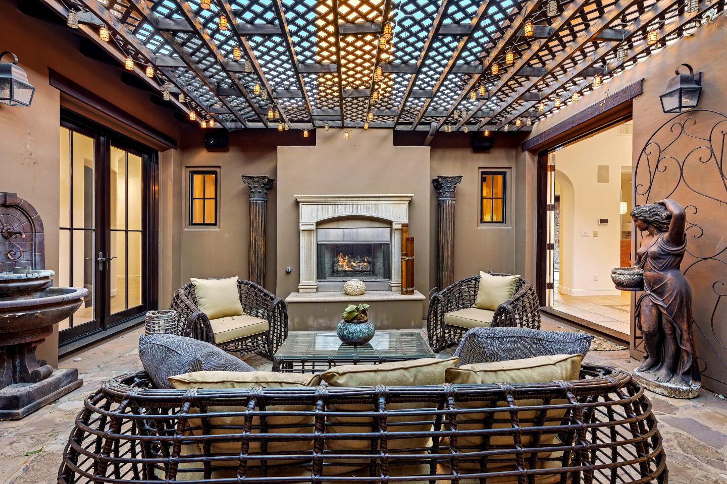 Remodeled by rapper Logic during his stay, this gated home in Calabasas includes a recording studio and a pergola-covered courtyard.
