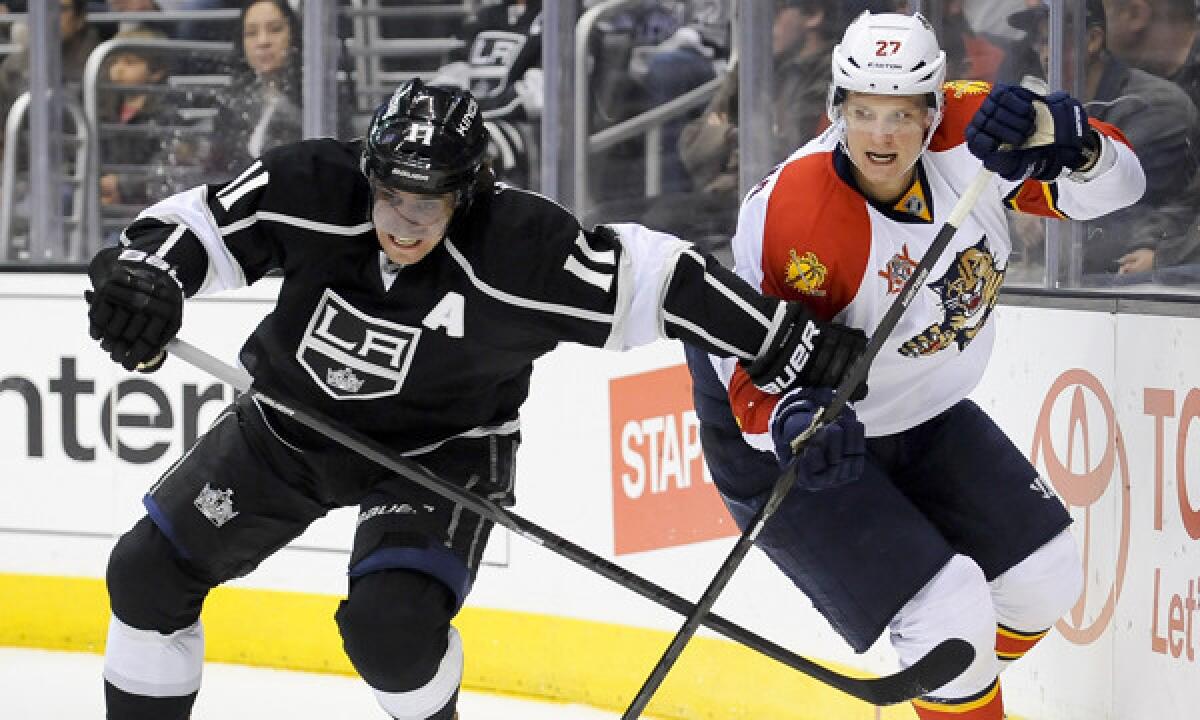 Kings center Anze Kopitar, left, and Florida Panthers center Nick Bjugstad battle for possession of the puck during the first period of the Kings' 4-0 win Saturday.