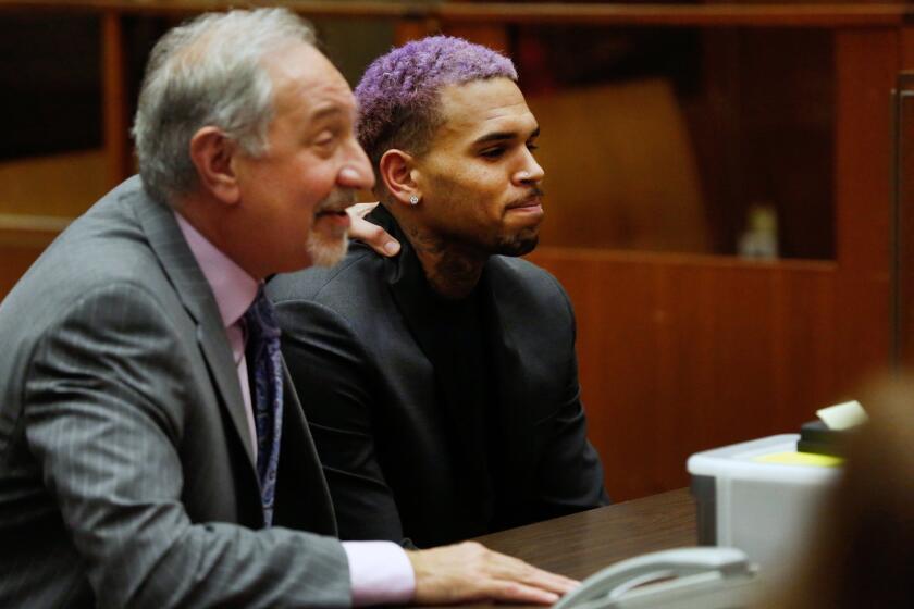 Chris Brown, right, appears with his attorney Mark Geragos, at a Friday court hearing in the R&B singer's long-running case over his 2009 attack on Rihanna.