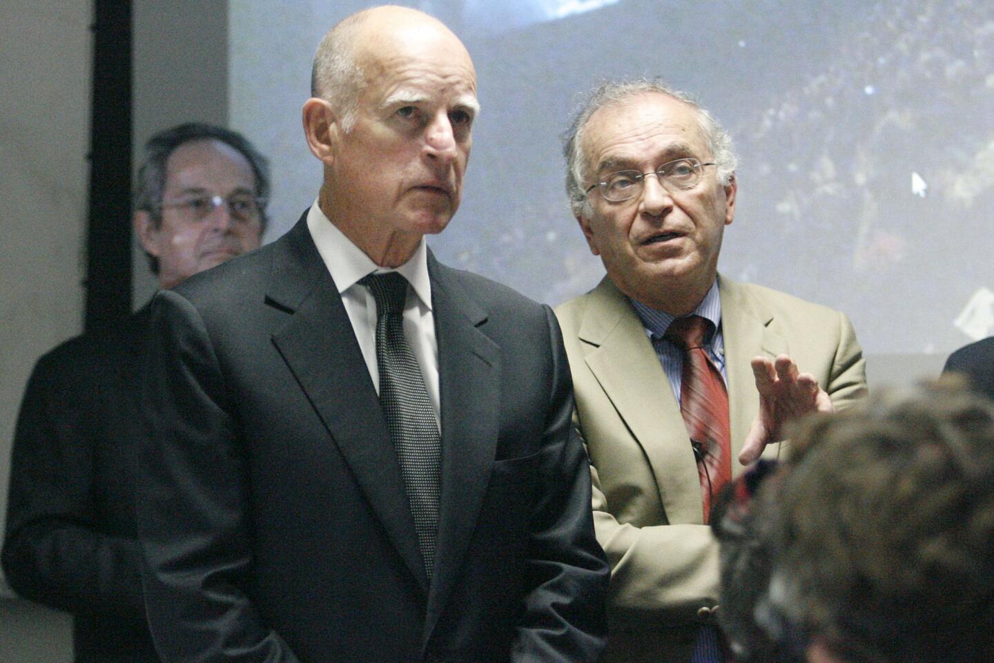 Gov. Jerry Brown, from left, listens to Caltech President Jean-Lou Chameau as he shows live footage of Mars rover Curiosity at JPL in Pasadena on Wednesday, August 22, 2012.