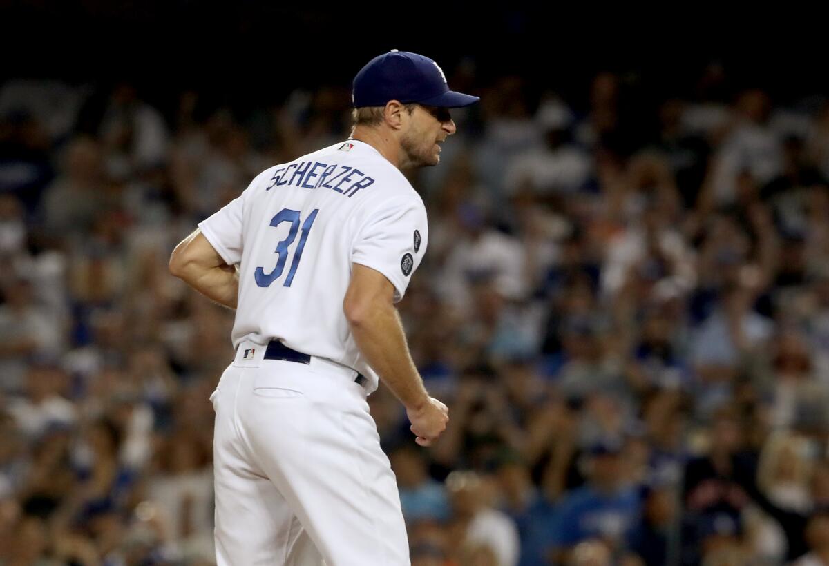 Dodgers pitcher Max Scherzer reacts after closing out the Houston Astros.