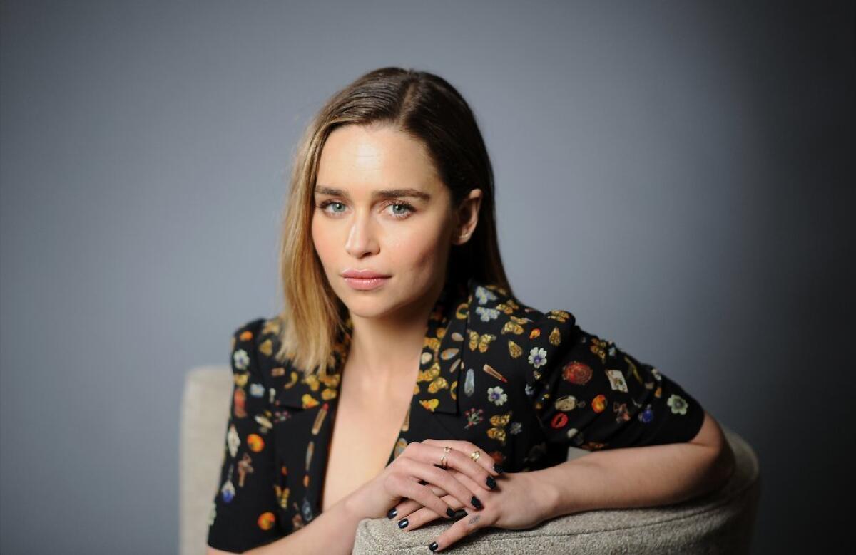 Emilia Clarke doesn't shy from the complaints in some quarters about a perceived misogynistic streak in "Game of Thrones." "The show is pretty equal in terms of strong men and strong women," she says.