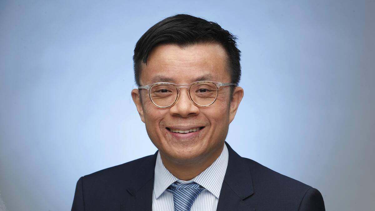 Sewell Chan smiles in a portrait.