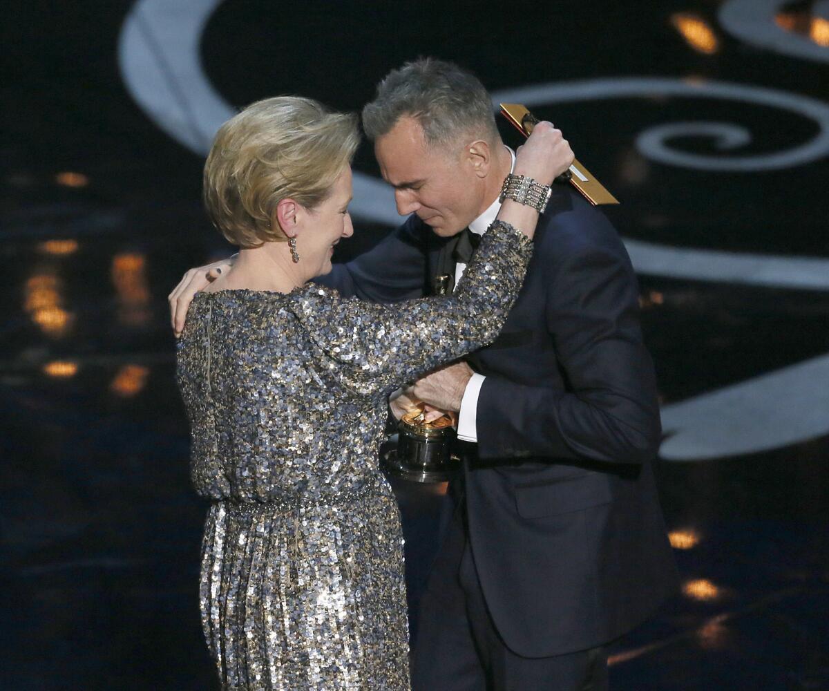Meryl Streep congratulates Daniel Day-Lewis on his lead actor Oscar.