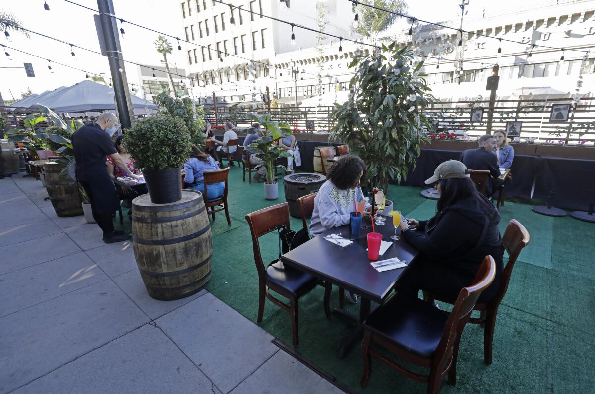 Visitors to Old Pasadena dine outdoors along Colorado Boulevard 