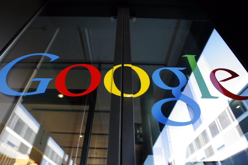 The Google logo is seen on the front door of the Google Engineering center in Zurich, Switzerland.