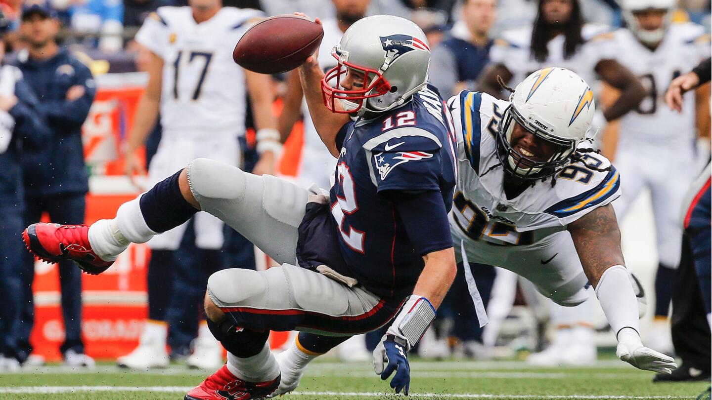 Darius Philon the Chargers tackles Patriots quarterback Tom Brady during the fourth quarter.