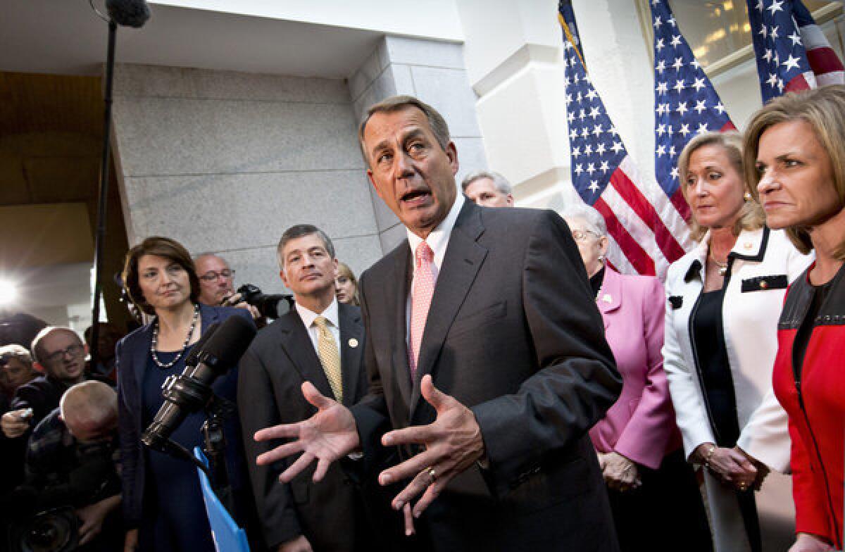 House Speaker John Boehner of Ohio, center, joined by fellow Republicans, speaks on Capitol Hill on Thursday following a closed-door GOP meeting.