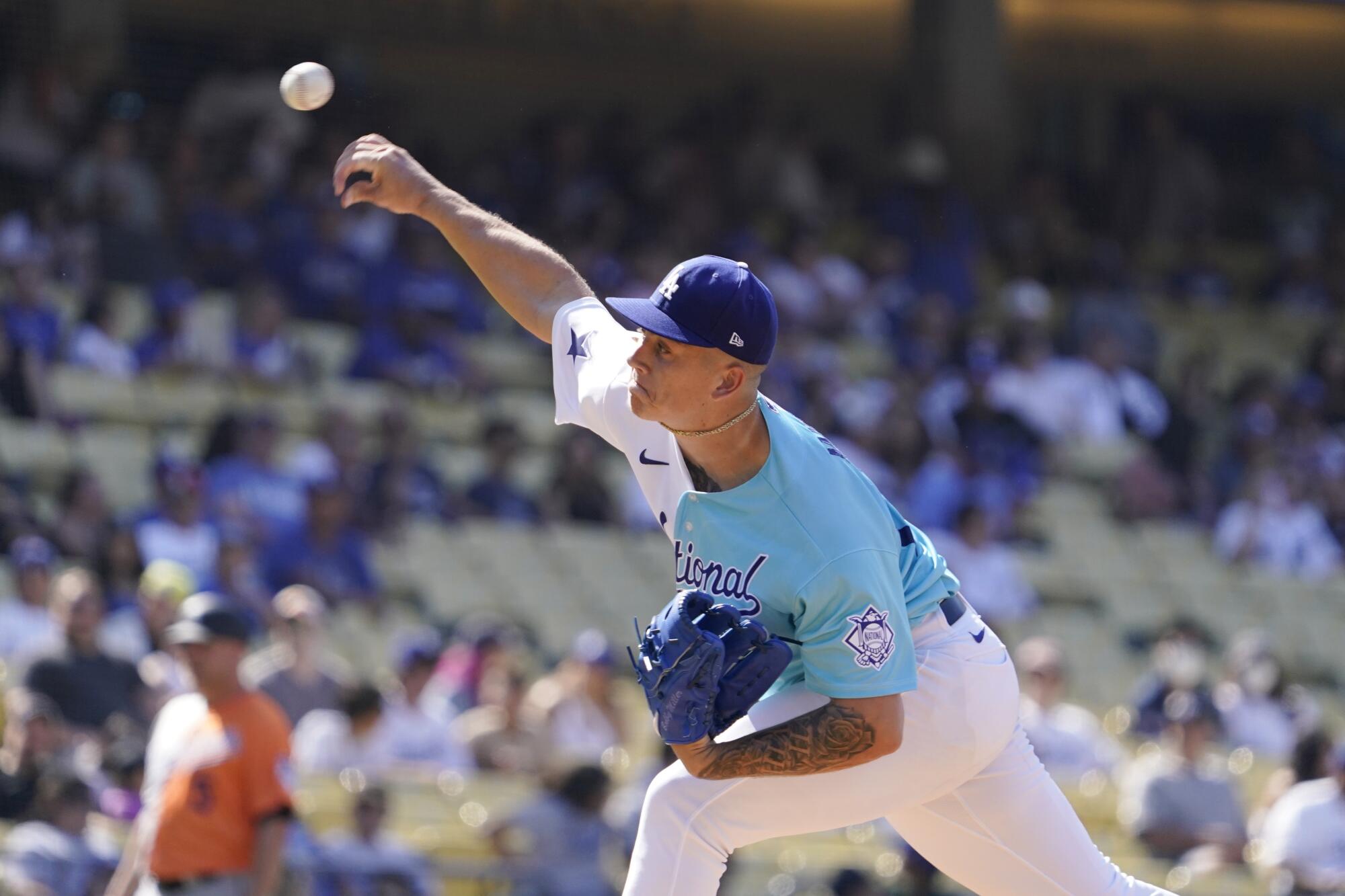 Dodgers starting pitcher Bobby Miller throws in the MLB All-Star Futures game in July 2022.