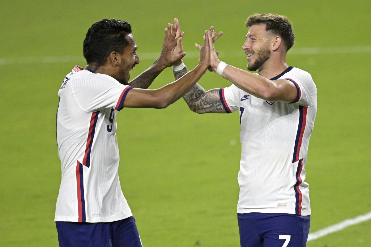 U.S. forward Jesus Ferreira, left, and forward Paul Arriola celebrate a goal.