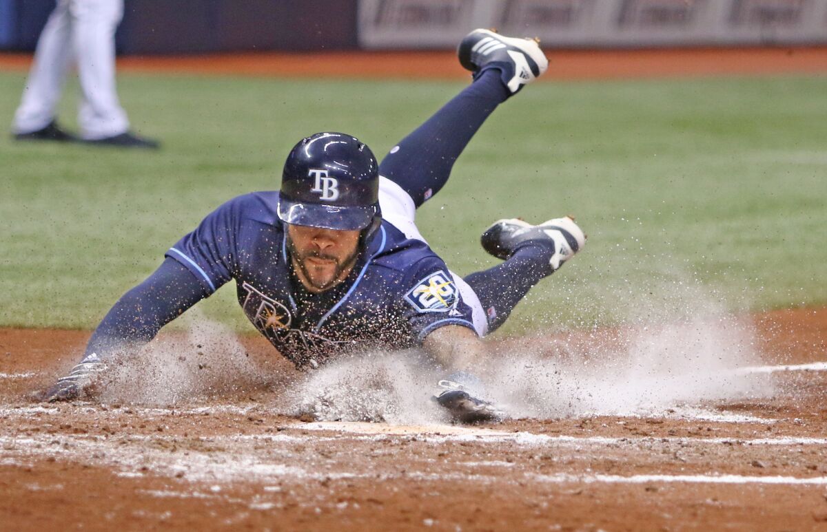 The Tampa Bay Rays' Tommy Pham slides home on a wild pitch in the fourth inning during against the Los Angeles Angels at Tropicana Field in St. Petersburg, Fla., on Thursday, Aug. 2, 2018. The Rays won, 4-2. (Jim Damaske/Tampa Bay Times/TNS) ** OUTS - ELSENT, FPG, TCN - OUTS **