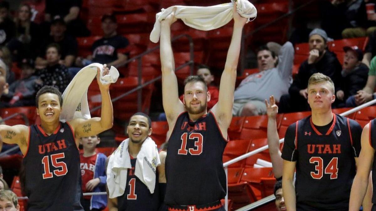 Utah's Lorenzo Bonam (15), JoJo Zamora (1), David Collette (13) and Jayce Johnson (34) watch during the second half of a win against California on Mar. 2.