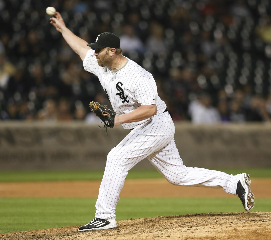 White Sox designated hitter Adam Dunn pitching in the ninth inning of the White Sox's 16-0 loss to the Rangers on Thursday at U.S. Celluar Field.