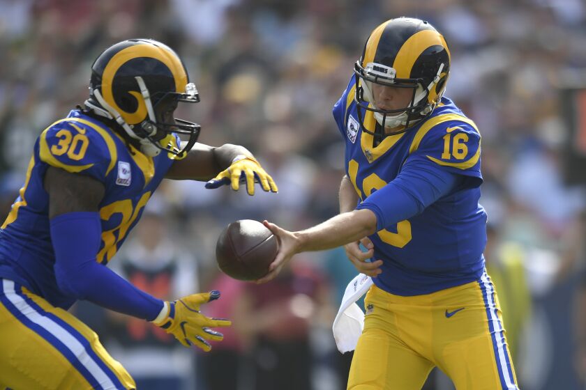 LOS ANGELES, CA - OCTOBER 28: Todd Gurley #30 takes a handoff from Jared Goff #16 of the Los Angeles Rams at Los Angeles Memorial Coliseum on October 28, 2018 in Los Angeles, California. (Photo by John McCoy/Getty Images)