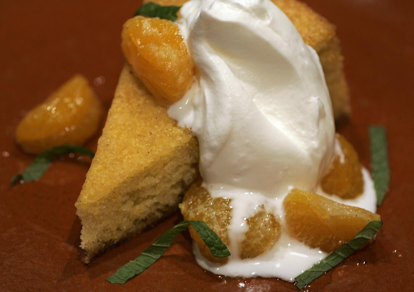Olive oil cake with creme fraiche and candied tangerines