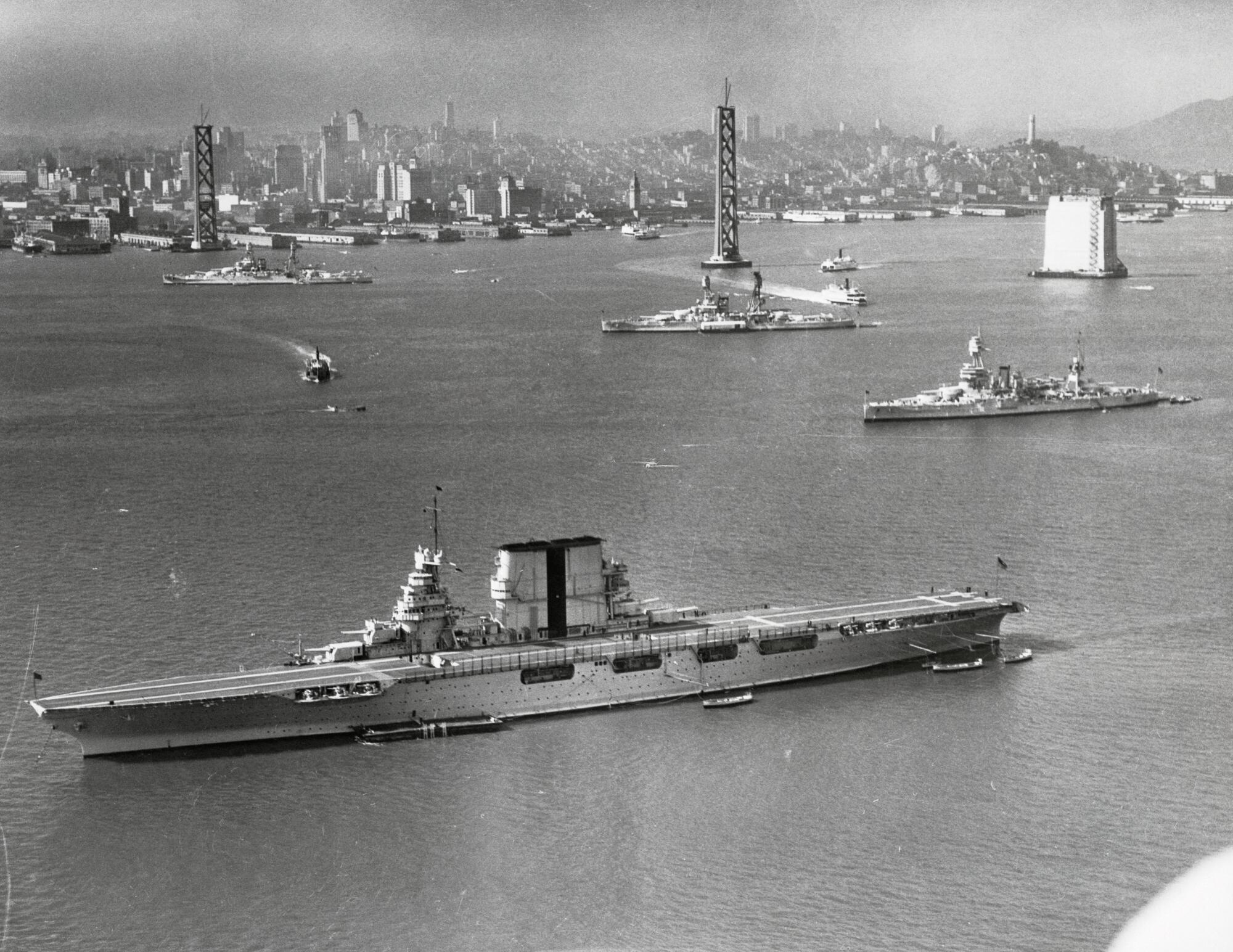 Black and white image shows military ships in San Francisco Bay