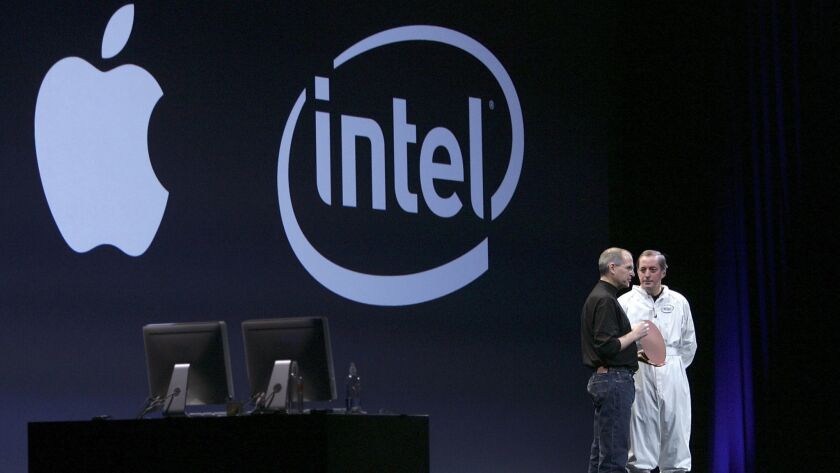 In 2005, Apple announced a move to Intel chips in its Macs, an initiative that later put former Intel Chief Executive Paul Ottelini, right, on stage with Apple co-founder Steve Jobs at the 2006 Macworld expo.