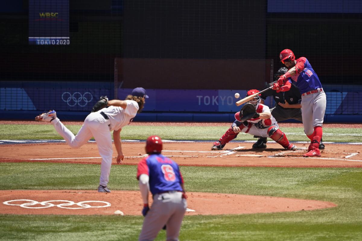 Scott Kazmir pitches the baseball to Julio Rodriguez at the Tokyo Olympics.