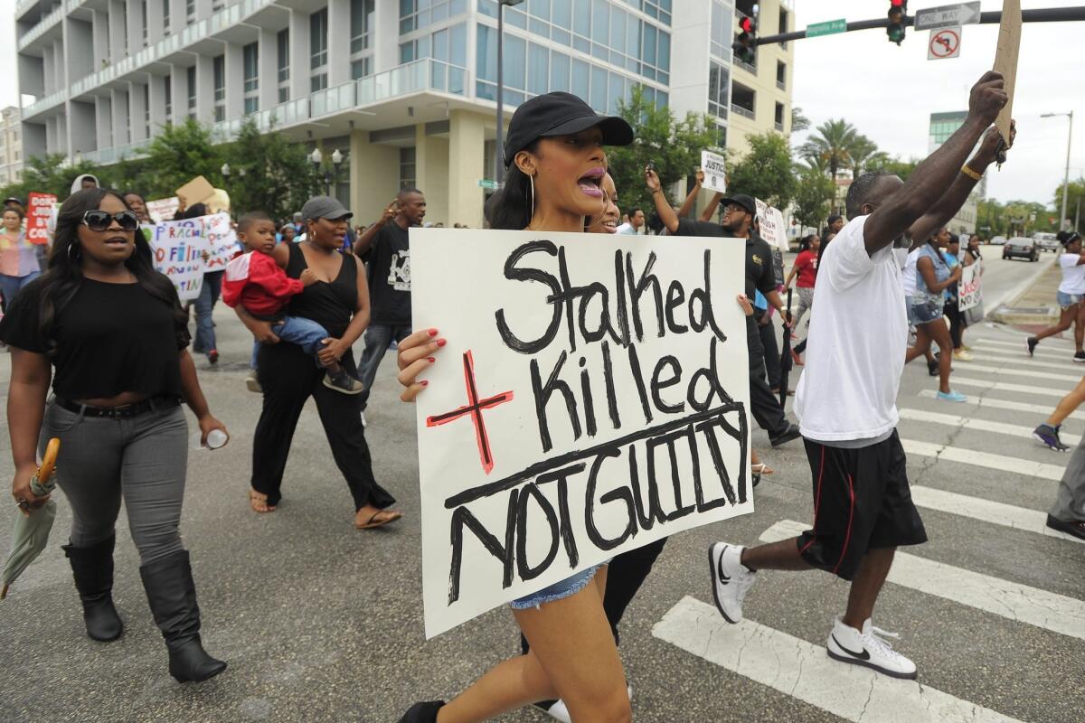 Nearly 1,500 people took part in a "March Against Gun Violence" in Orlando, Fla., days after George Zimmerman was found not guilty in the shooting death of Trayvon Martin.