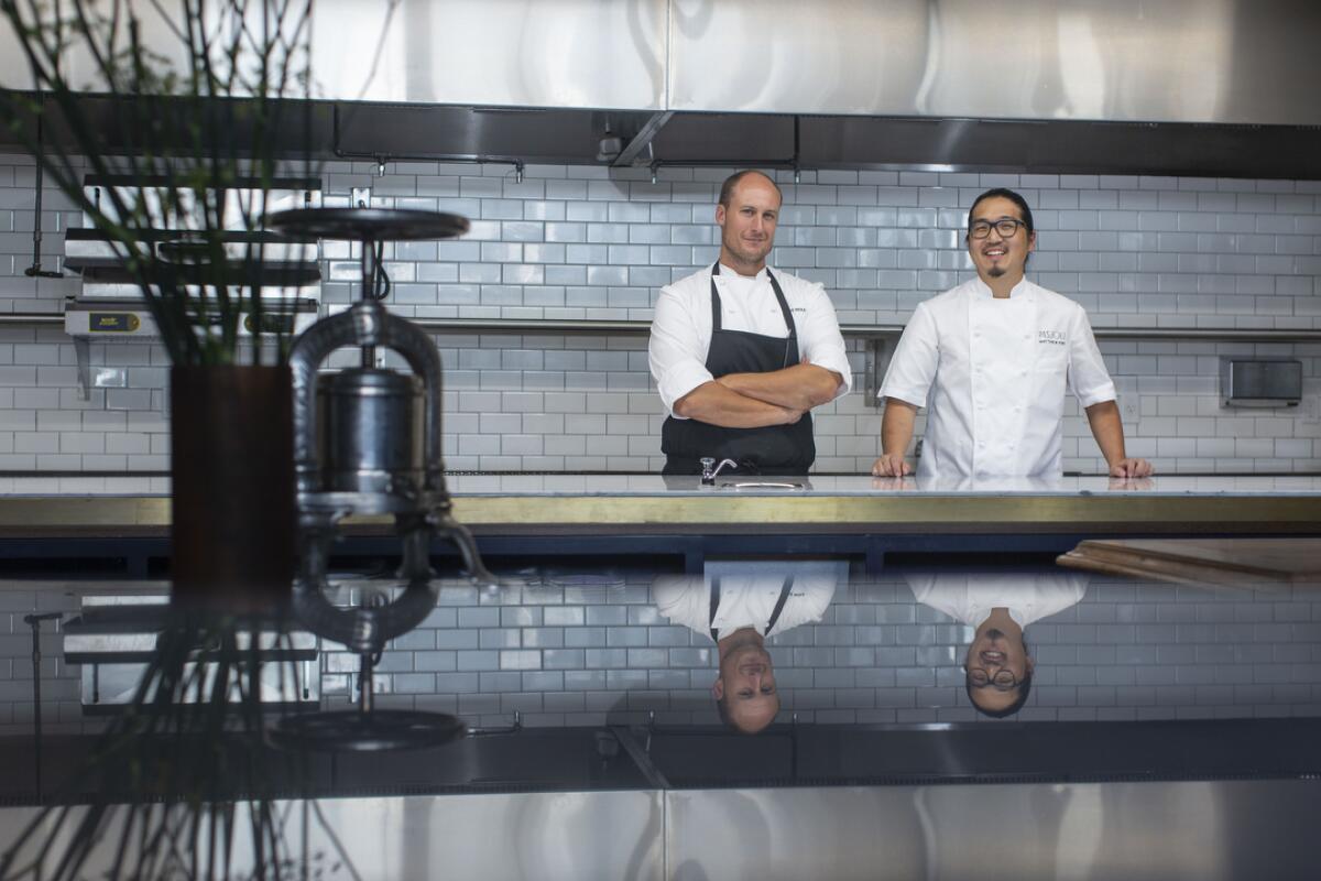Chef Dave Beran, left, and Pasjoli's chef de cuisine Matthew Kim