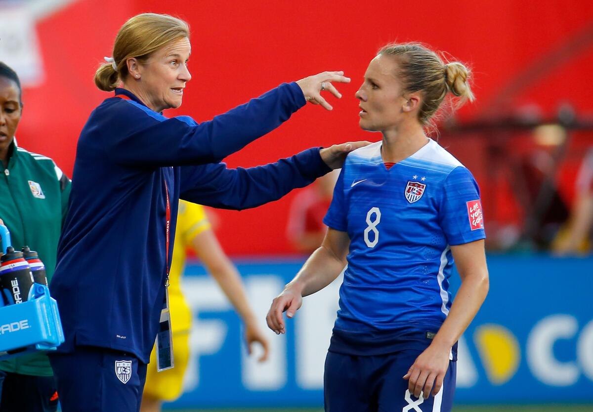 U.S. Coach Jill Ellis talks with forward Amy Rodriguez during the second half of a match against Sweden on June 12 at the Women's World Cup.