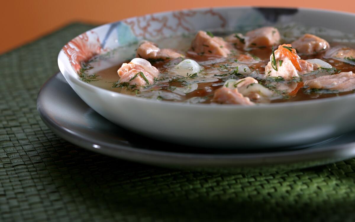 Salmon with tomato, dill and garlic soup (canh rieu ca)