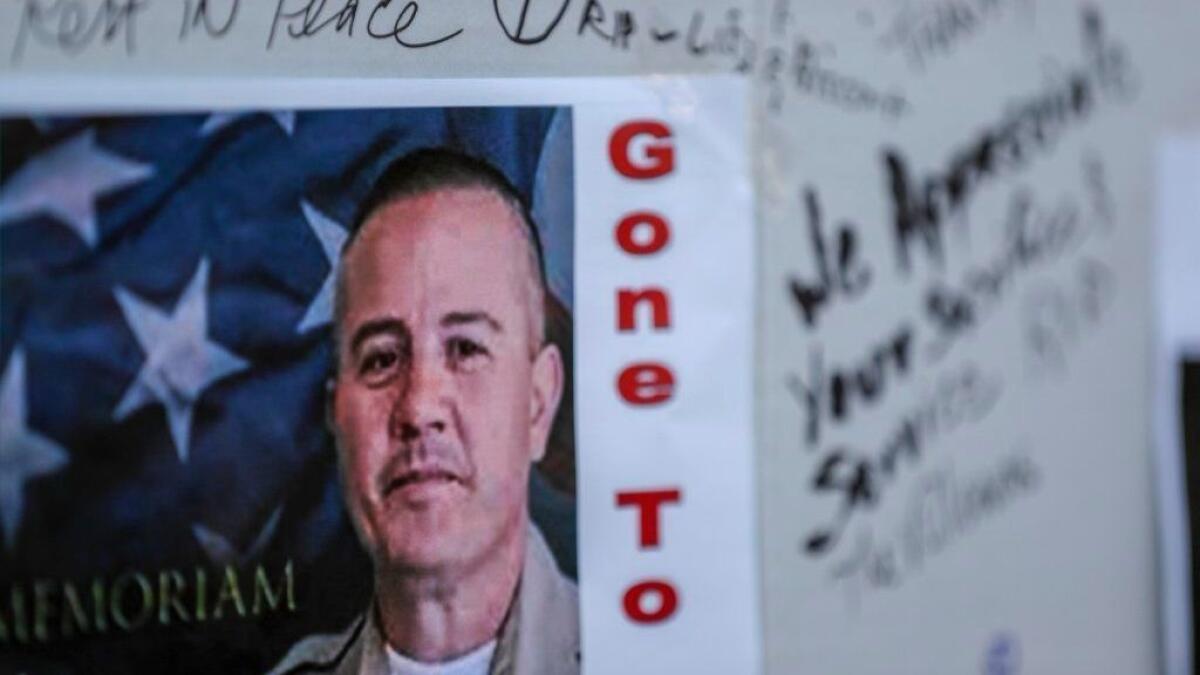 Notes of support in memory of slain Los Angeles County Sheriff's Department Deputy Joseph Solano outside the fast-food restaurant where he was shot.